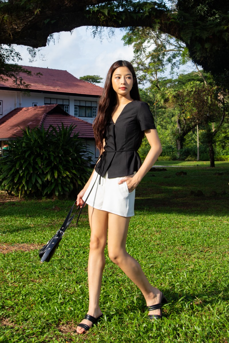 RESTOCK: Jorelle Wrap Peplum Top in Black