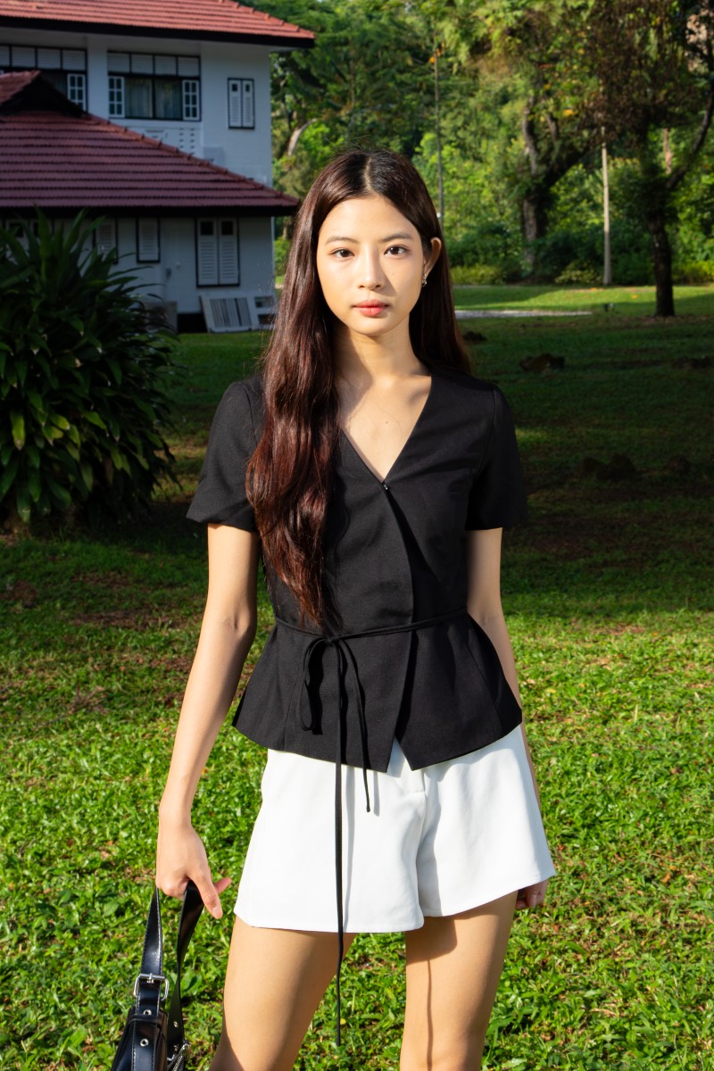 Jorelle Wrap Peplum Top in Black