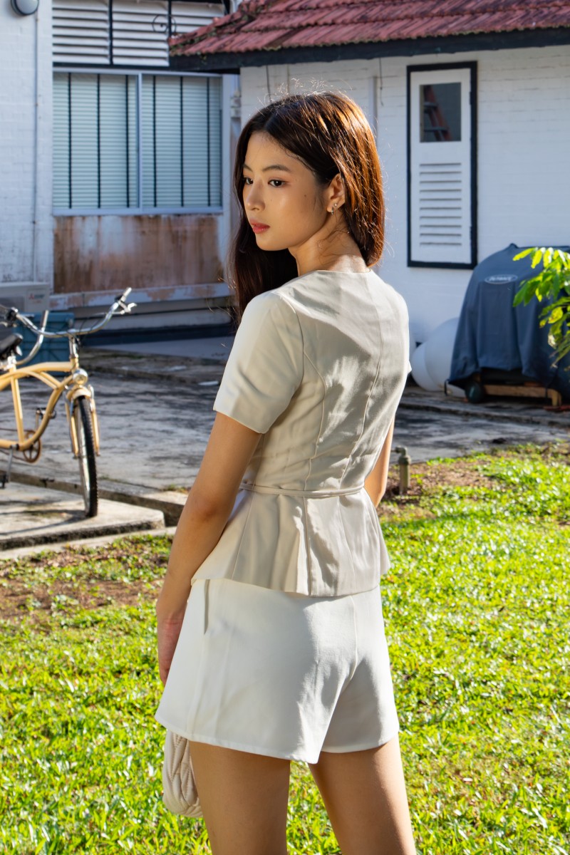 Jorelle Wrap Peplum Top in Ivory