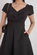 Carline Textured Wrap Dress in Black